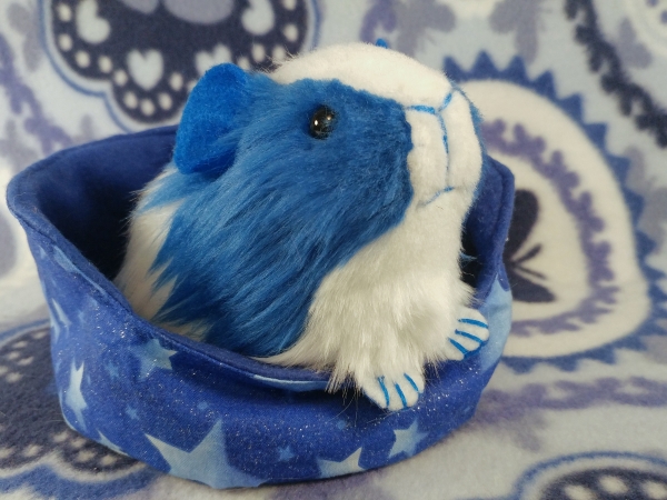 Plush toy of a blue guinea pig